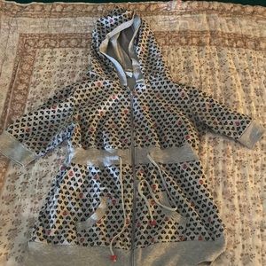 Y2K Emo zip up short sleeve sweatshirt top with skull and broken heart graphics.